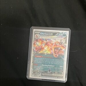 Pokemon Charizard EX Card with Red and Blue Accents